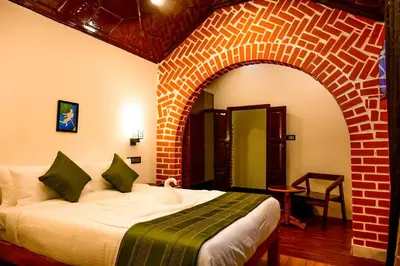 a bedroom with a bed in a room with a brick wall at Coorg Mystere Luxury Home Stay in Madikeri