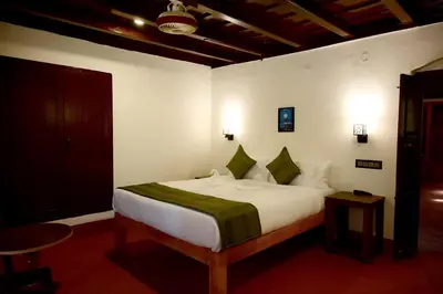 a bedroom with a large bed in a room at Coorg Mystere Luxury Home Stay in Madikeri