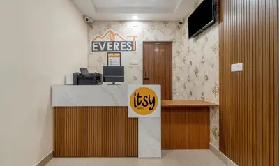 an office with a desk with a sign on the wall at Itsy Hotels Everest Leela Residency in Erode