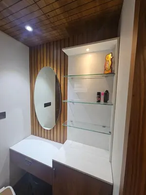 a bathroom with a mirror and a white sink at Dreams Premium Villa in Kozhikode