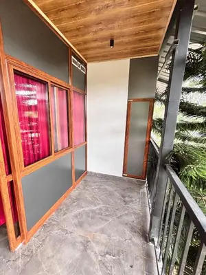 a room with a staircase and a window at Soul Stay in Munnar