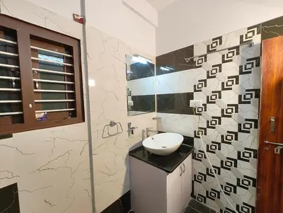 a bathroom with a sink and a mirror at Casa de Shalom - 3 Bedroom AC Villa 65