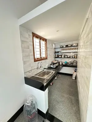 a kitchen with a sink and a counter top at Bhargavi homes in Coimbatore