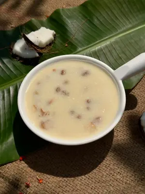 a bowl of soup on top of a banana leaf at Chetty's Mane by Raho - Estate-View Heritage Stay in Siddapur