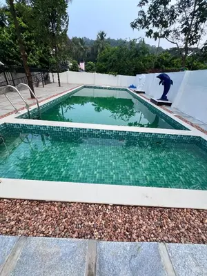 a man riding a skateboard in a swimming pool at Haveninn in Kallana