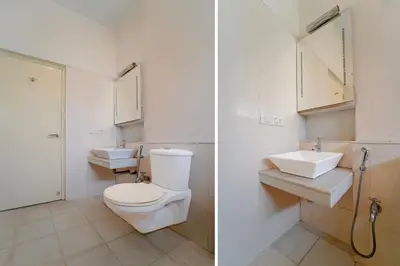 a bathroom with a toilet and a sink at Palette Nirvana Signature Apartment by CheckIn, Coimbatore in Coimbatore