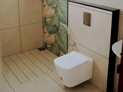 a bathroom with a toilet and a shower at Camplights Stays in Tariyod