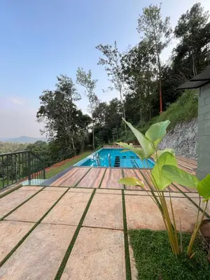 a swimming pool in the middle of a yard at Camplights Stays in Tariyod