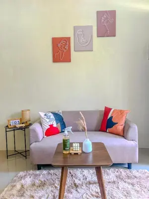a living room with a couch and a coffee table at Malayattoor Castle in Kodanad
