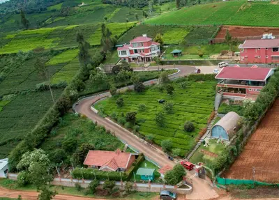 an aerial view of a village on a hill at Western Valley Resorts Ooty in Ooty