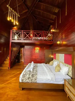 a bedroom with a large bed in a room at Western Valley Resorts Ooty in Ooty