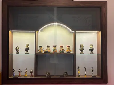a display case with a bunch of vases in it at 5 BHK Luxurious & Spacious Villa in Mysuru in Mysore