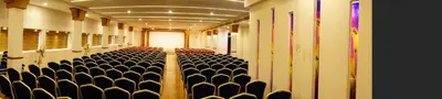 an empty room with a row of chairs in a building at Sathya Inn Guruvayur in Trichūr