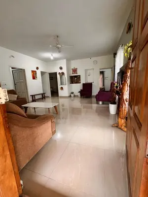 a large living room with couches and a table at Malma view homestay in Kakkabe