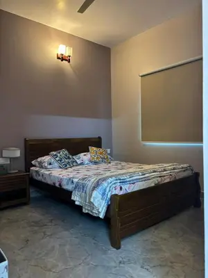 a bedroom with a bed in a room at Villa Vista in Mysore