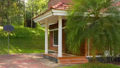 a small house with a palm tree in front of it at Aquatica by bough'n villa in Kenichira