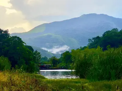 a view of a river with mountains in the background at Karlad Lake Palace Waterfront Resort by stayRAa in Tariyod
