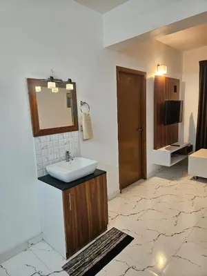 a bathroom with a sink and a mirror at krishna paadham in Guruvāyūr