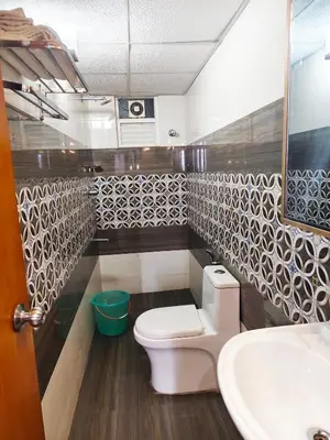 a bathroom with a toilet and a sink at krishna paadham in Guruvāyūr