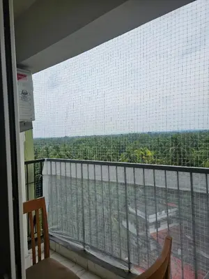 a room with a balcony with a view at krishna paadham in Guruvāyūr