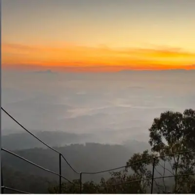 a view of the sky with a layer of clouds at Cybele Hill Resort in Kalpetta
