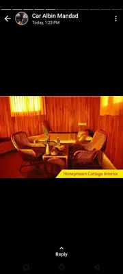 a picture of a living room with two chairs and a table at Cybele Hill Resort in Kalpetta