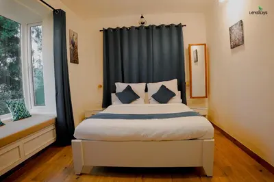 a bedroom with a bed with a black curtain at Hope Horizon Luxury Villa By LexStays in Coonoor
