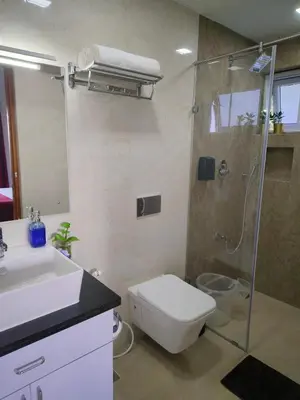 a bathroom with a shower and a toilet and a sink at Hope Horizon Luxury Villa By LexStays in Coonoor