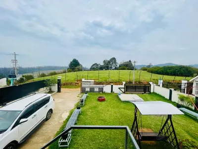 a white van parked on the roof of a house at Teyt Castle - Ooty - Nilgiris in Ooty