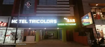 a store front with a sign that reads he heel trippers at Hotel TriColors Ramnagar Gandhipuram in Coimbatore