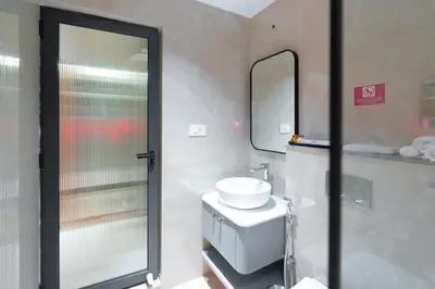 a bathroom with a sink and a mirror at celestia by thoppil in Kottakkal
