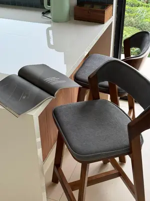 a pair of chairs sitting next to a counter at Ozone The Misty Villa - Hill View in Coonoor