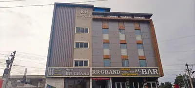 a tall building with a bar in front of it at RR Grand Inn in Coimbatore