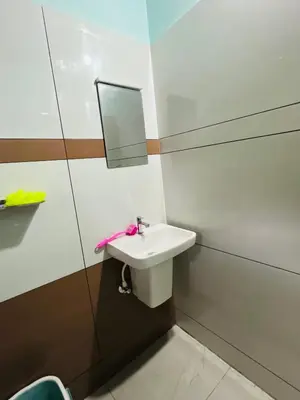 a bathroom with a sink and a mirror at Edakkal Hearth in Ambalavayal