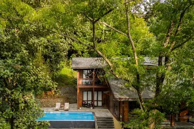 a house in the woods with a swimming pool at amã Stays & Trails - Iris Villa, Kozhikode in Puthuppādi
