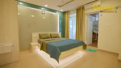 a bedroom with a bed in a room at Padmalaya Homestay ! in Guruvāyūr