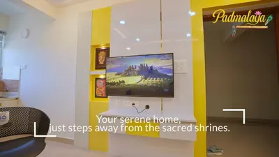 a tv hanging on a wall in a room at Padmalaya Homestay ! in Guruvāyūr