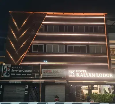 a building with a sign on the side of it at Hotel Kalyan in Erode