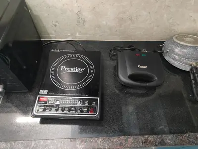 a desk with a controller and a mouse at Vani Vilas Luxury Villa in Mysore