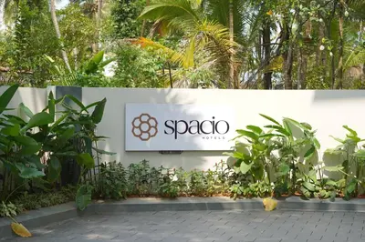 a sign for a spa at a resort at Hotel Spacio in Kozhikode