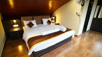 a bedroom with a large bed in a room at Era Resort Slope Stay in Kodaikānāl