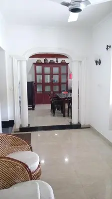 a dining room with a table and chairs at Salisbury Manor Heritage Inn in Marayoor