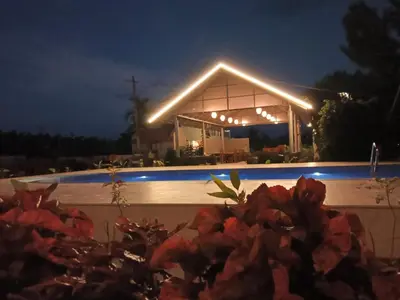 a building with lights on top of it at night at The fox resort in Bandipūr