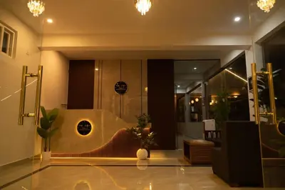 a lobby with a shower with a bench in it at The fox resort in Bandipūr