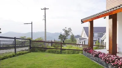 a balcony with a view of a house at 3 Bhk Villa Ooty - Casa de Amor by EBR in Ooty
