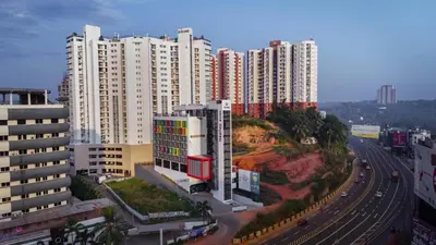 an aerial view of a city with tall buildings at Nestlay Suites by TC One in Kozhikode