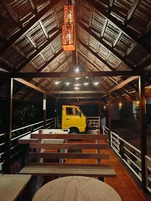 a church with a yellow van parked in the middle at South point in Ammatti