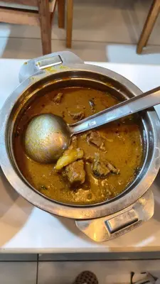 a pot of soup with a spoon in it at South point in Ammatti