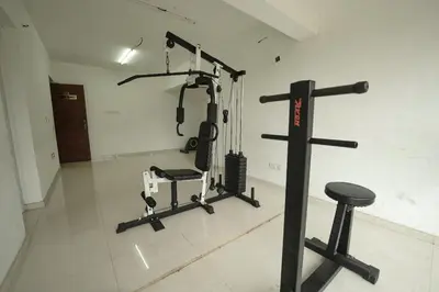 a room with a gym with two tread machines at Mirage Luxuria Inn in Vythiri