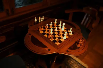 a wooden chess set on top of a table at Milntown Bungalow 200 years old Colonial Stay in Coonoor in Coonoor